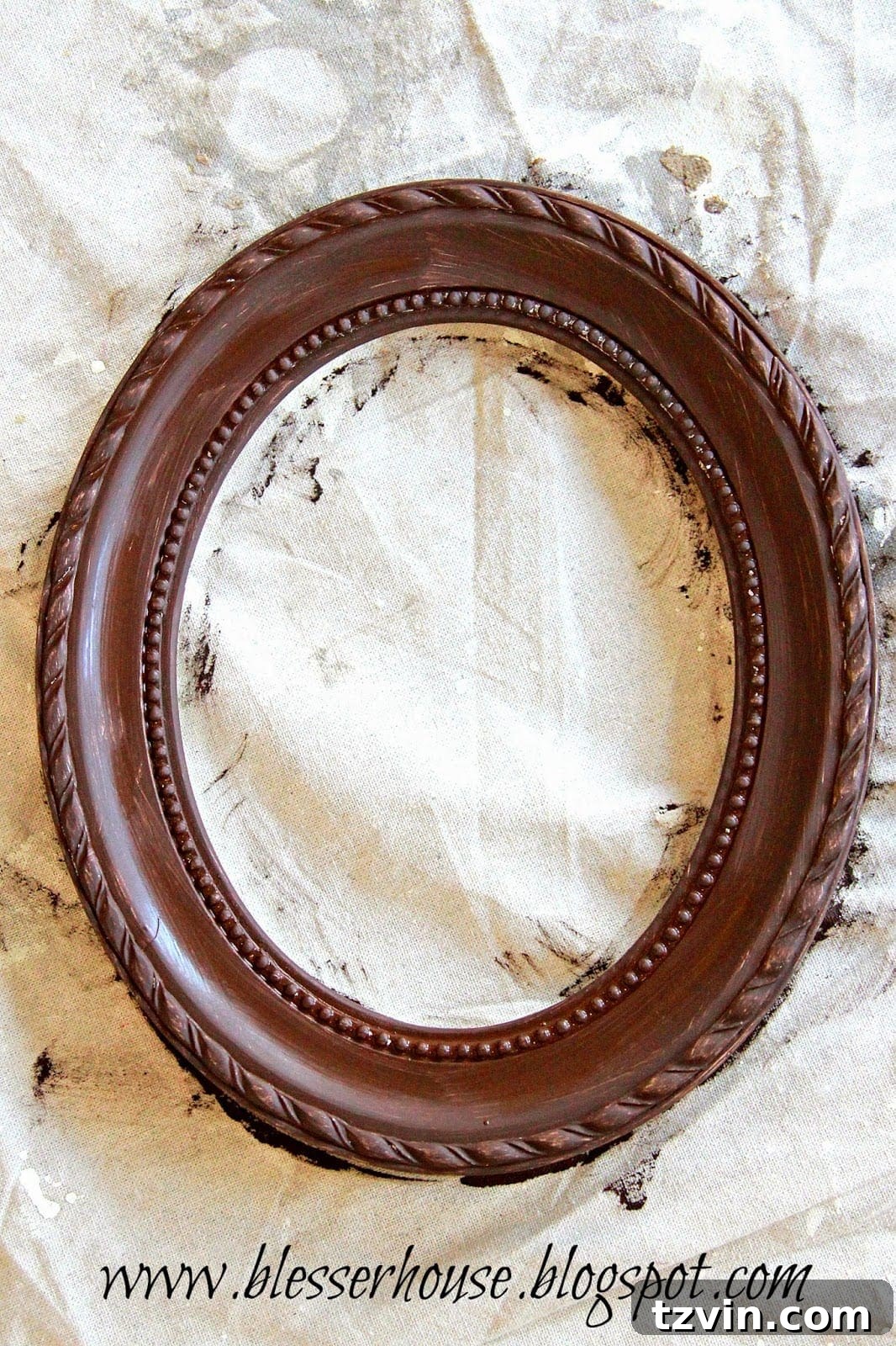 Picture frames painted with a base coat, ready for distressing