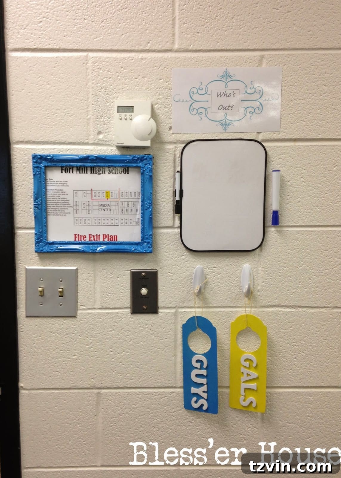 Exit station by the door with a bathroom pass board.