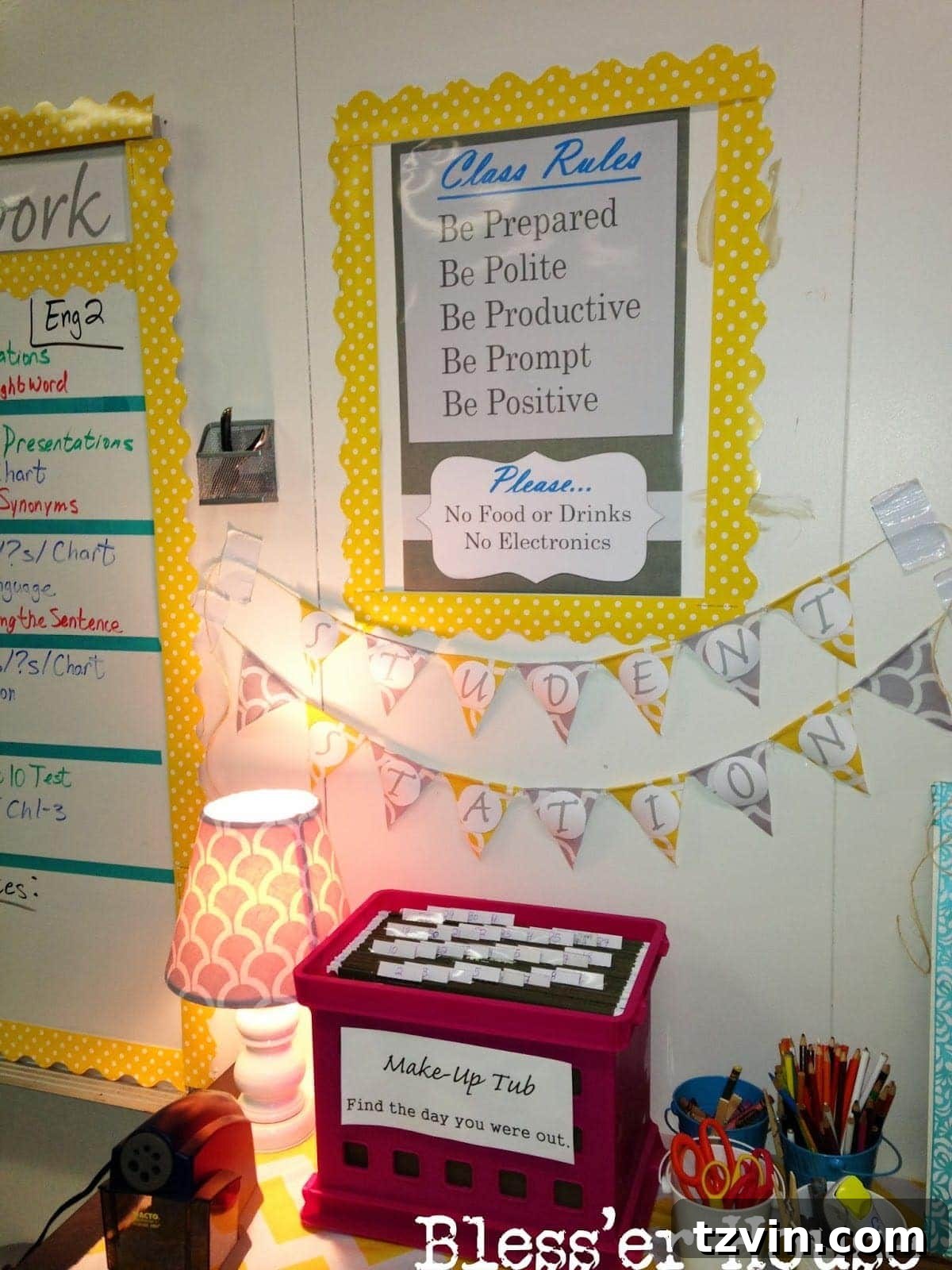 Classroom rules poster next to a student supply station.