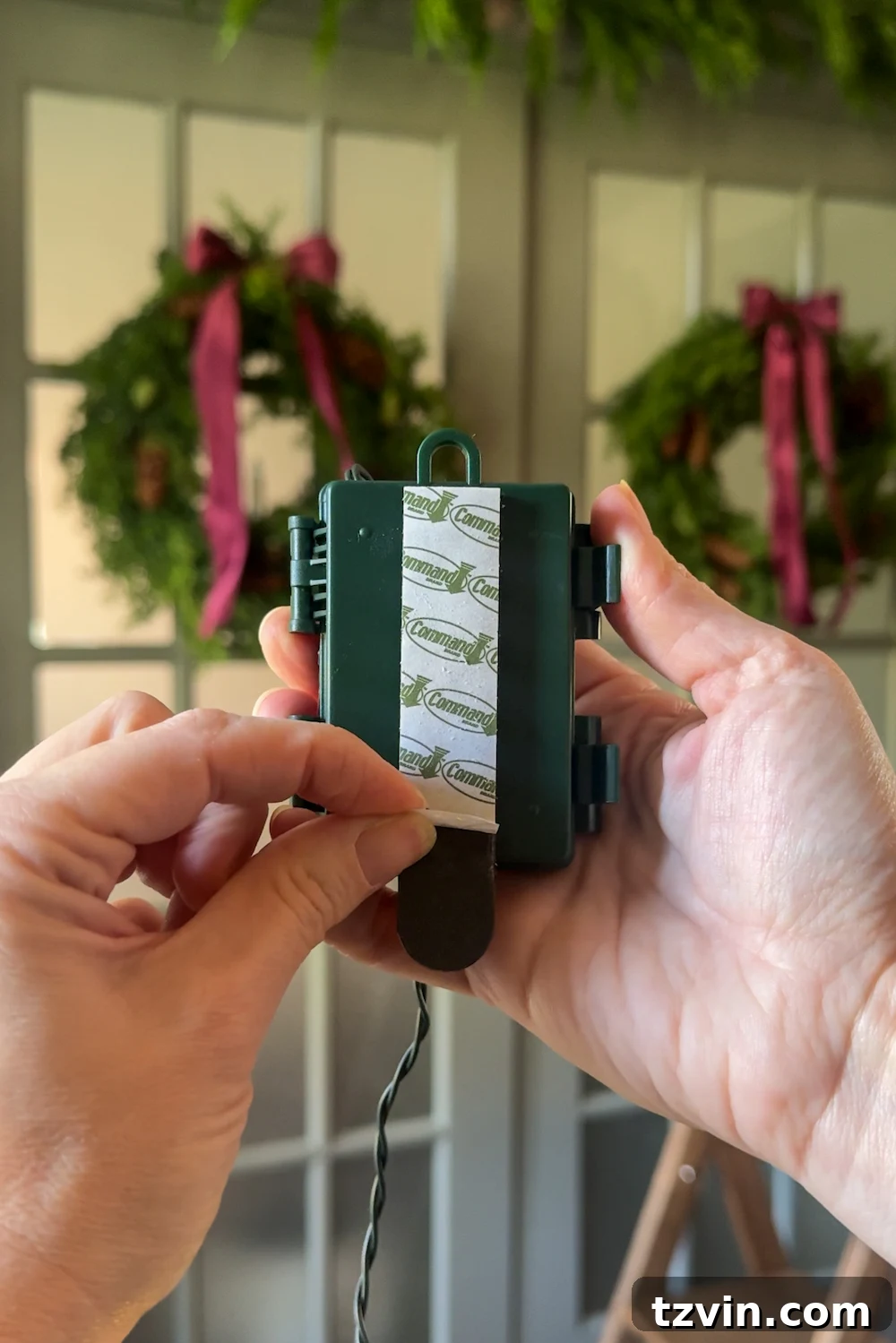 Adding warm, battery-operated lights to the doorway garland