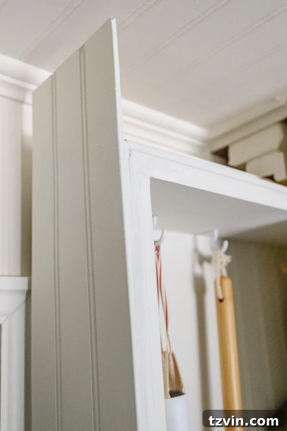 Hidden DIY broom cupboard and cleaning supply storage in a laundry room - Beadboard Installation