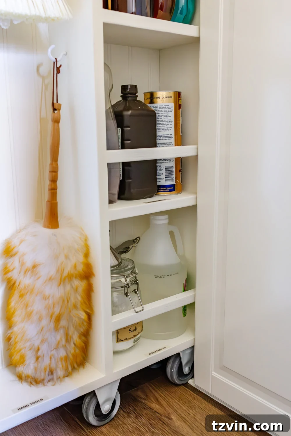 Hidden DIY broom cupboard and cleaning supply storage in a laundry room