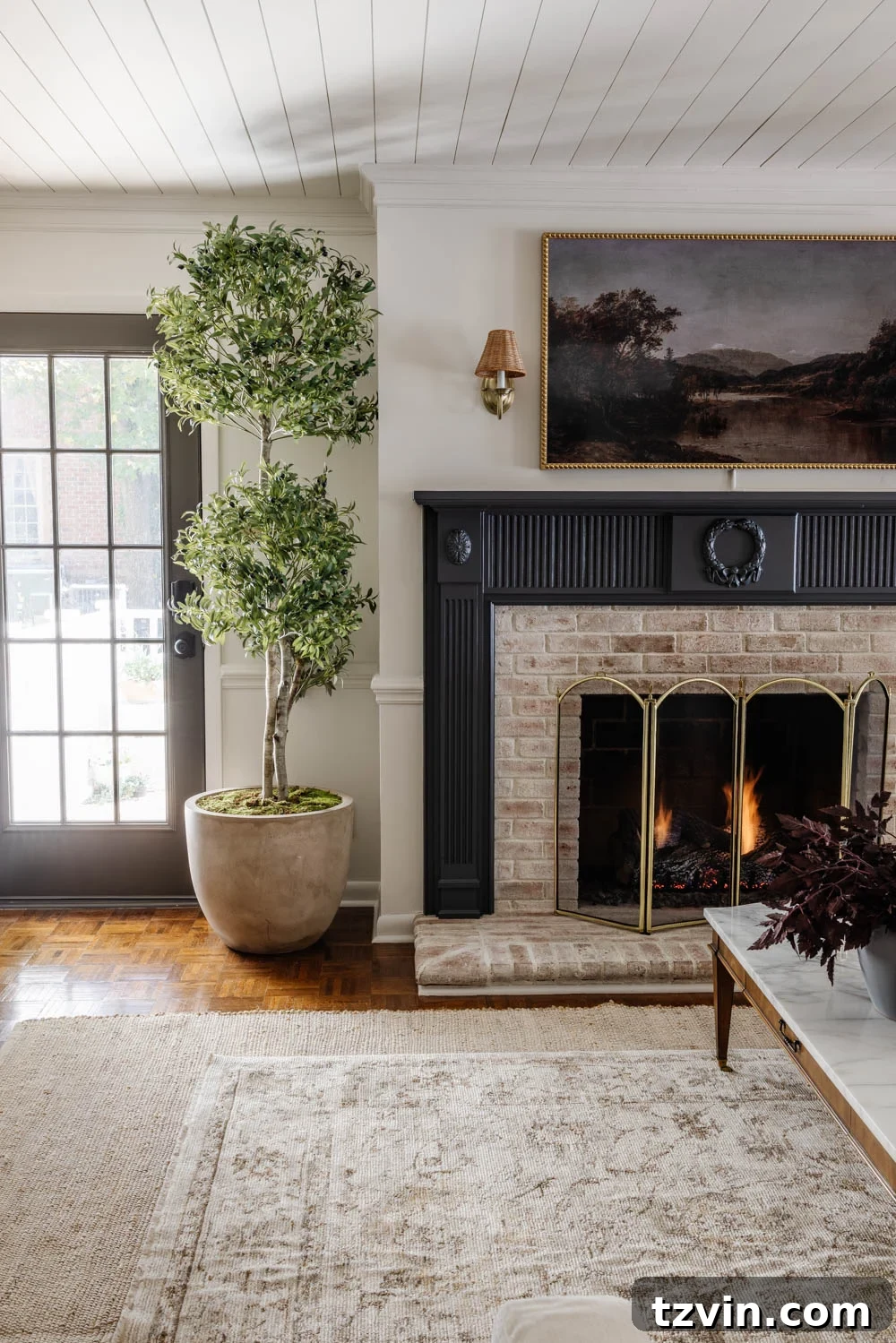 Layering Rugs: Expert Tips and Stylish Combinations 2 Living room showcasing beautifully layered rugs, enhancing the space's warmth and style.