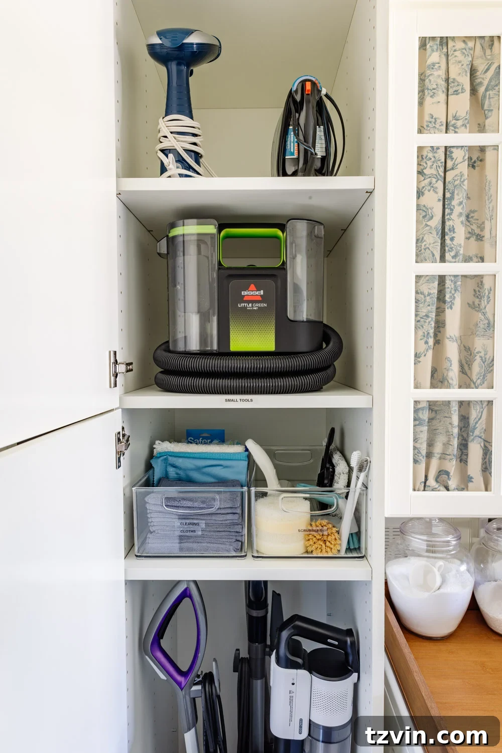 Maximizing Storage in Your Compact Laundry Room: Clever Organization Tips 11 Cleaning supplies stored in hidden broom cupboard