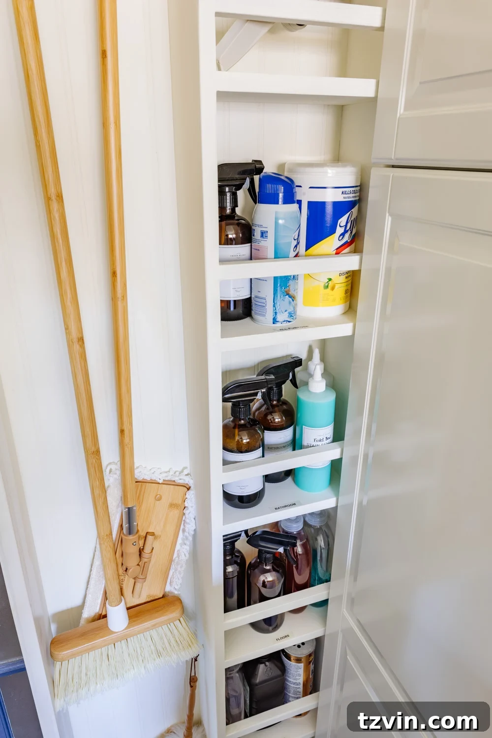 Maximizing Storage in Your Compact Laundry Room: Clever Organization Tips 13 Inside the hidden slide-out cleaning cupboard