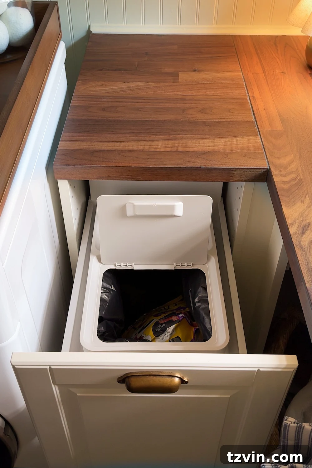 Maximizing Storage in Your Compact Laundry Room: Clever Organization Tips 14 Pull-out trash can drawer