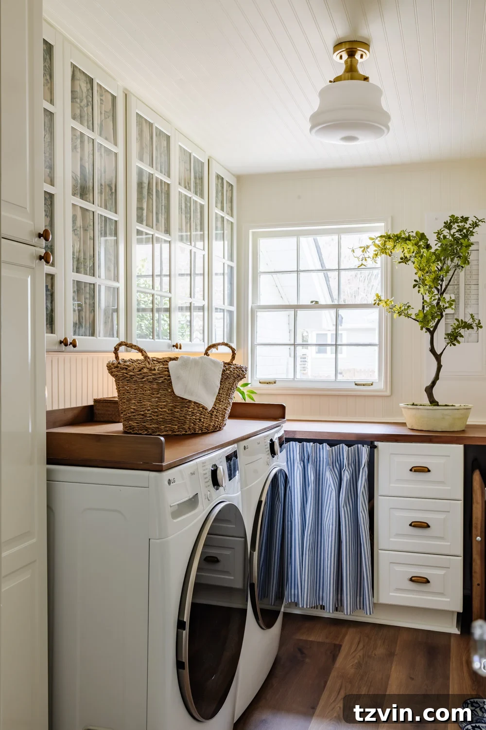 Maximizing Storage in Your Compact Laundry Room: Clever Organization Tips 27 Laundry room with fabric-covered cabinet doors and cafe curtains