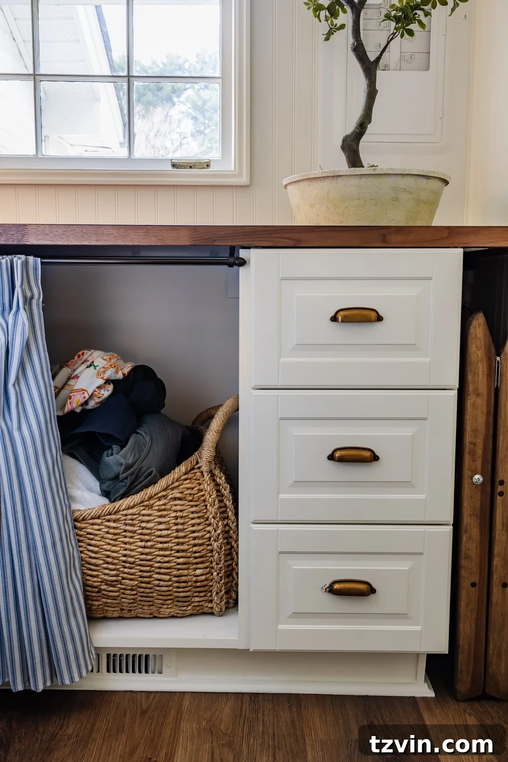 Maximizing Storage in Your Compact Laundry Room: Clever Organization Tips 9 Hidden hamper behind cabinet skirt