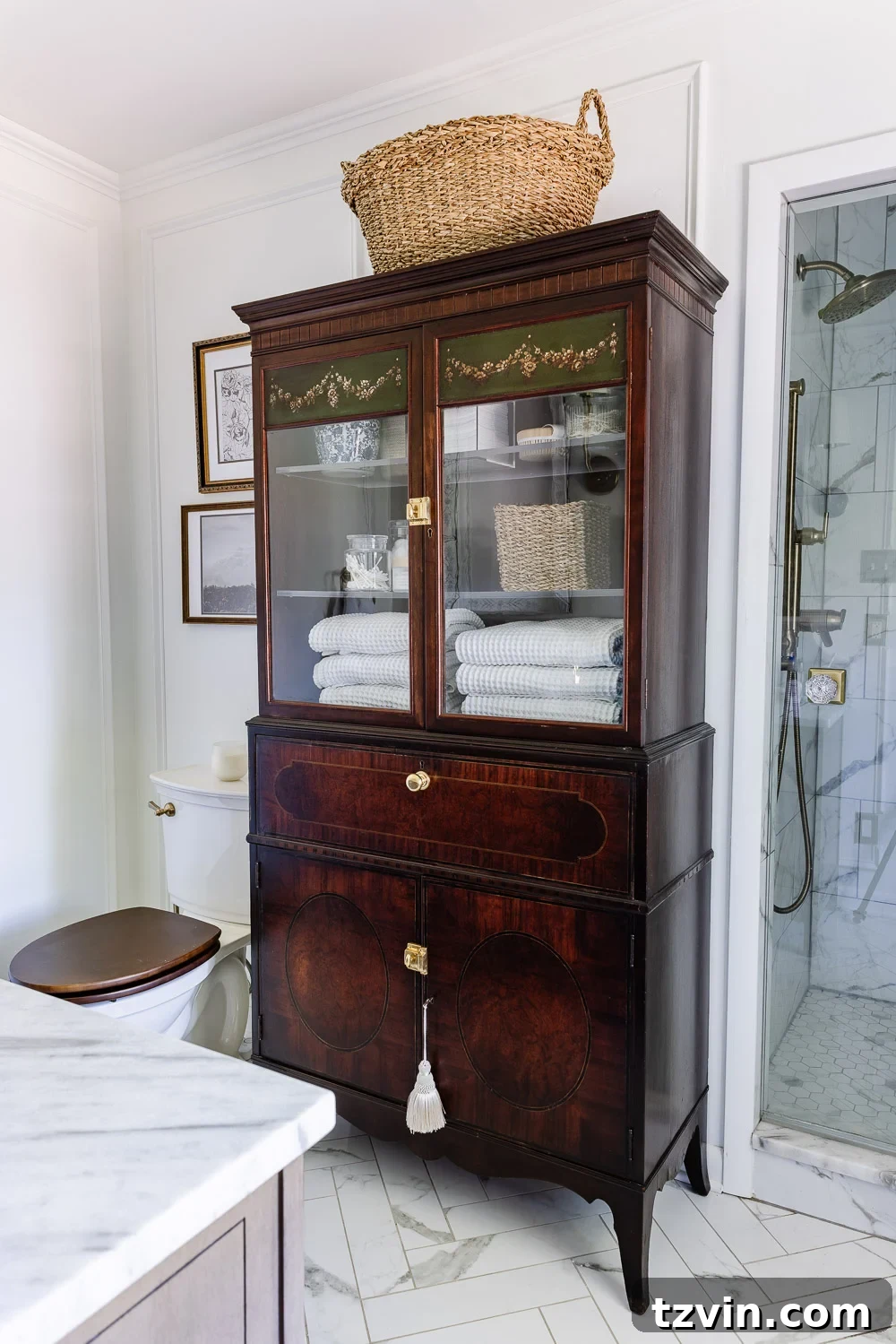 Repurposing a Secretary Desk: A DIY Makeup Vanity for Our Small Bathroom 2 Elegant secretary desk repurposed as a makeup vanity in a beautifully decorated small bathroom, featuring ample storage and a charming aesthetic.