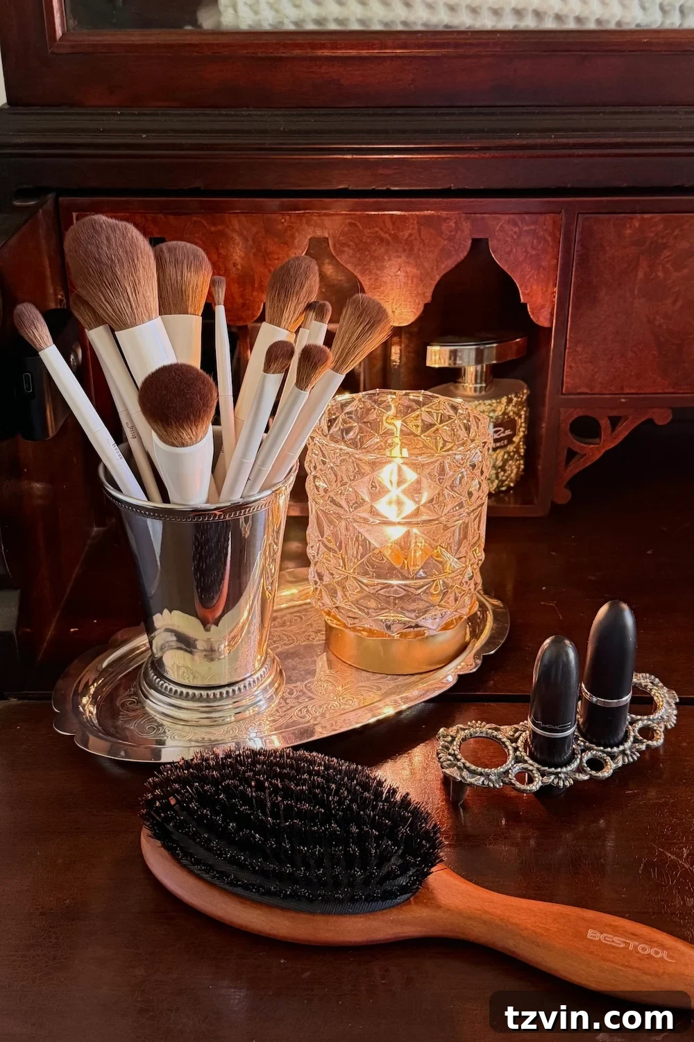 Repurposing a Secretary Desk: A DIY Makeup Vanity for Our Small Bathroom 8 Decorative chinoiserie jar and a stack of small face towels in a storage box, positioned neatly within the upper section of a secretary desk repurposed as a bathroom vanity.