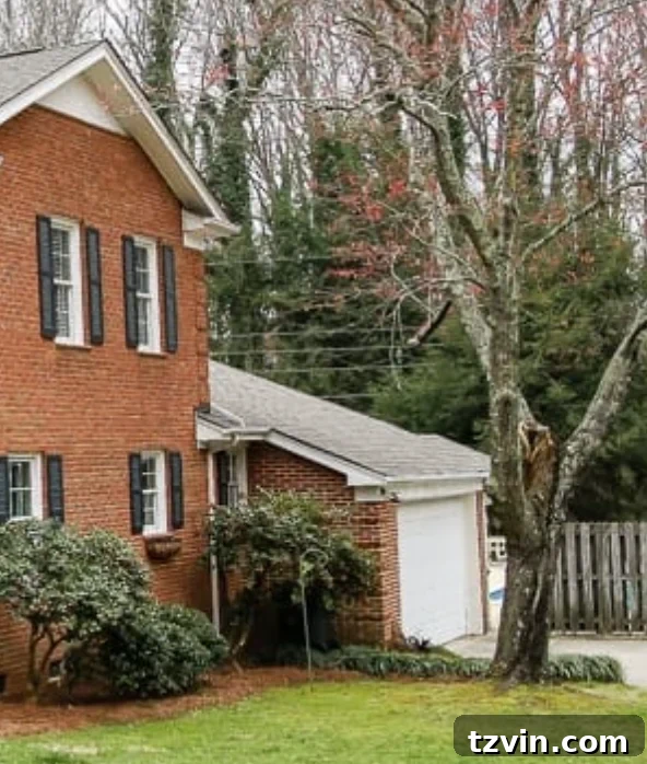 4 Garage Upgrades That Boost Curb Appeal 2 garage curb appeal with copper lanterns, star jasmine, and outdoor trash can hiding panels