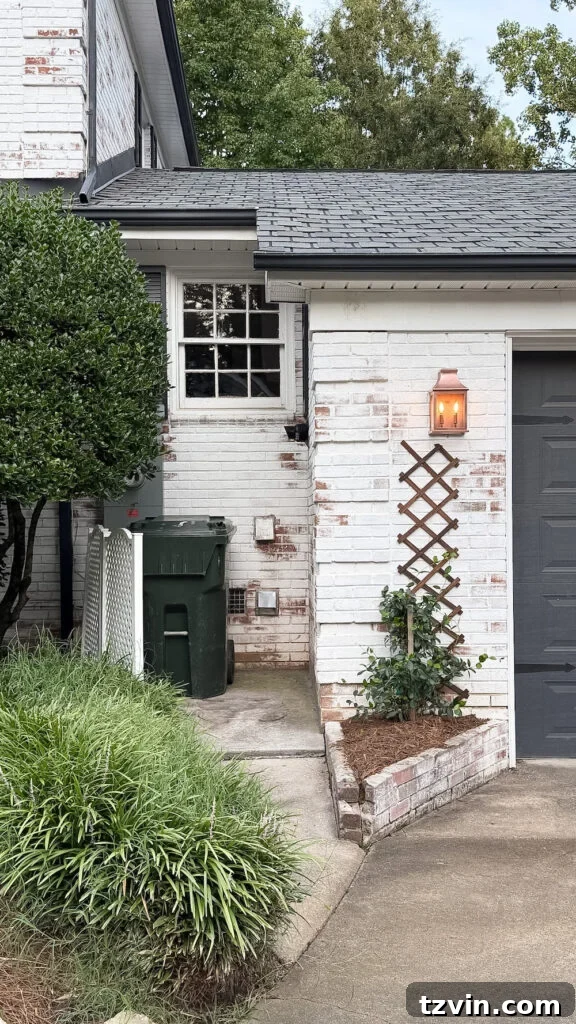 4 Garage Upgrades That Boost Curb Appeal 12 garage curb appeal with copper lanterns, star jasmine, and outdoor trash can hiding panels