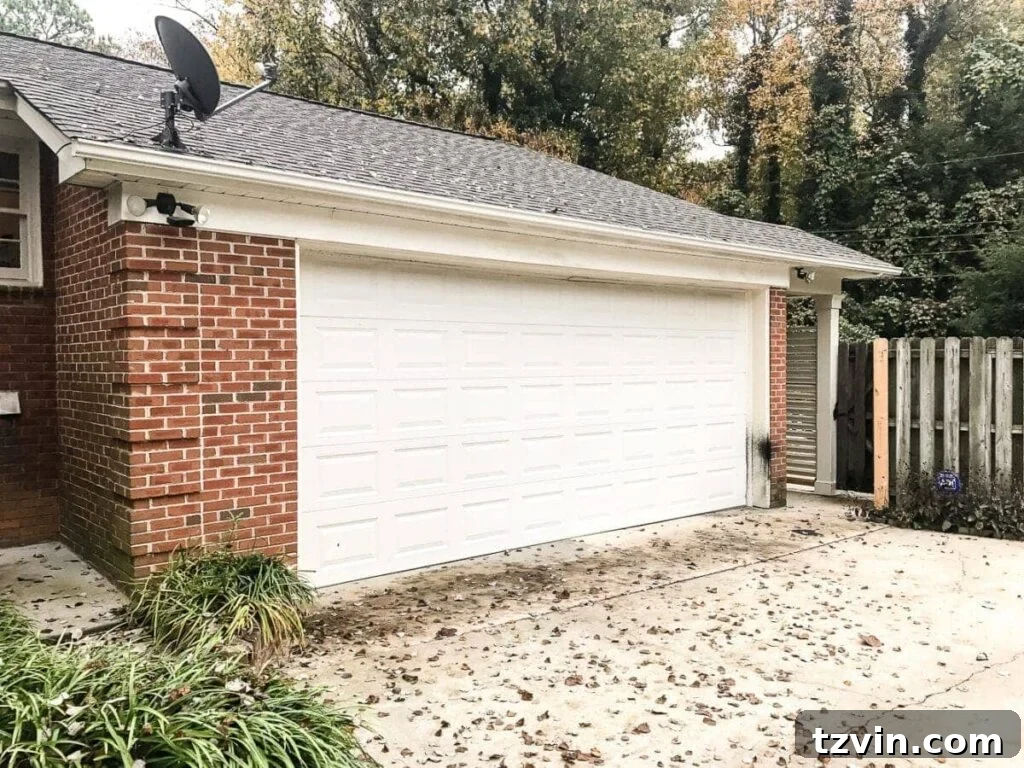 4 Garage Upgrades That Boost Curb Appeal 15 garage curb appeal with copper lanterns, star jasmine, and outdoor trash can hiding panels