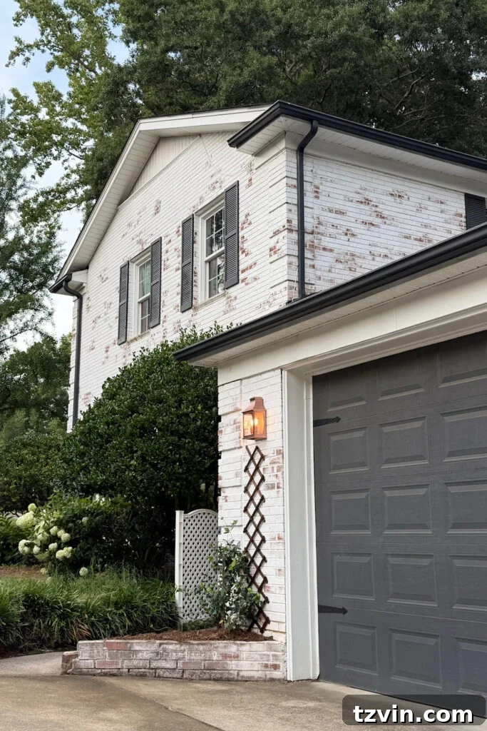 4 Garage Upgrades That Boost Curb Appeal 16 garage curb appeal with copper lanterns, star jasmine, and outdoor trash can hiding panels