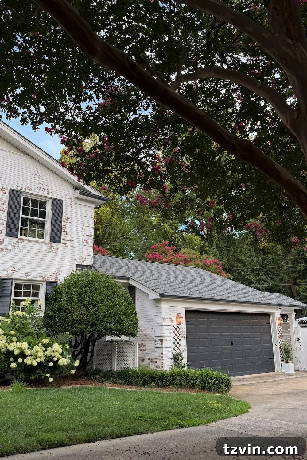 4 Garage Upgrades That Boost Curb Appeal 4 garage curb appeal with copper lanterns, star jasmine, and outdoor trash can hiding panels