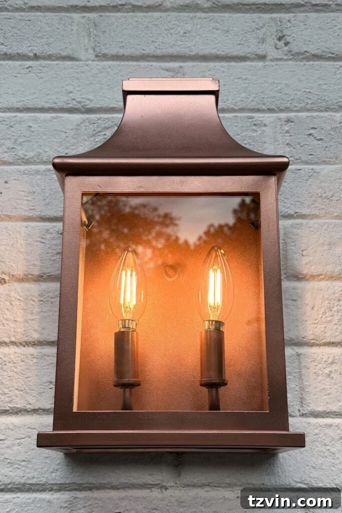4 Garage Upgrades That Boost Curb Appeal 6 garage curb appeal with copper lanterns, star jasmine, and outdoor trash can hiding panels