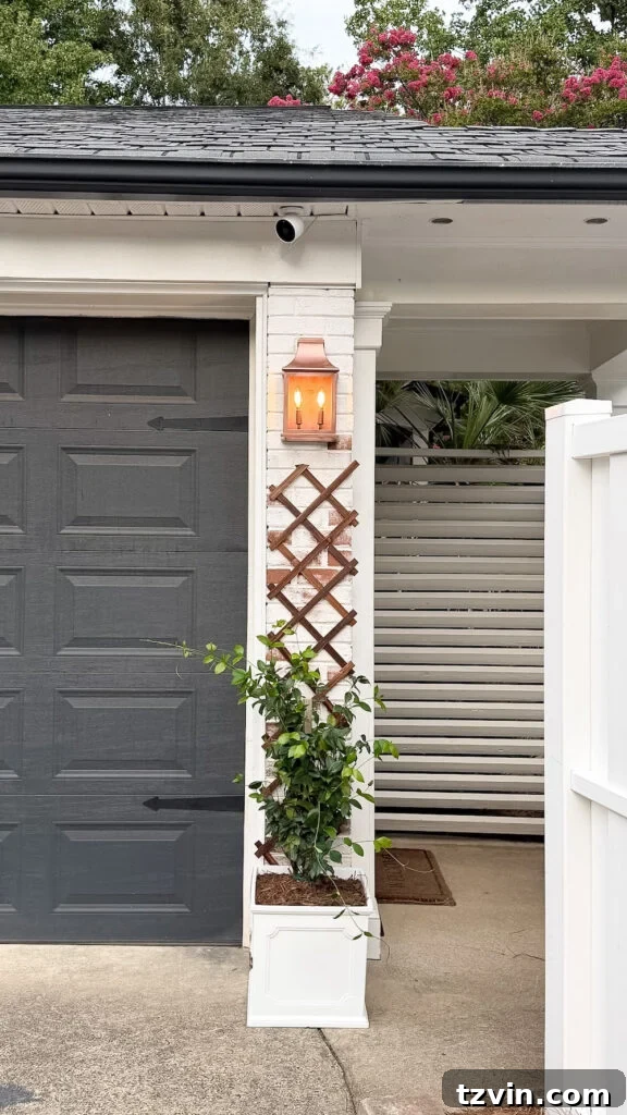 4 Garage Upgrades That Boost Curb Appeal 9 garage curb appeal with copper lanterns, star jasmine, and outdoor trash can hiding panels