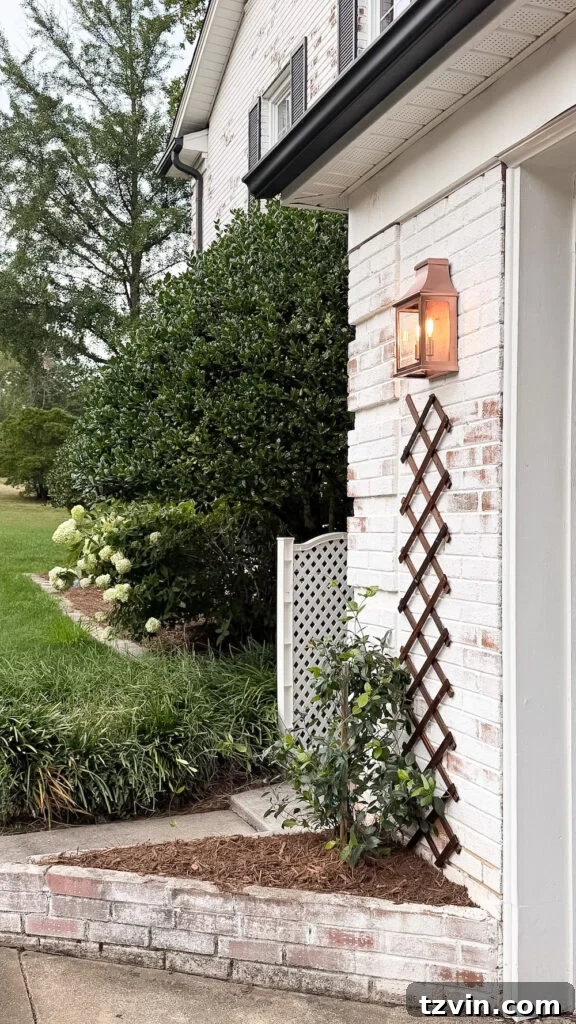 4 Garage Upgrades That Boost Curb Appeal 10 garage curb appeal with copper lanterns, star jasmine, and outdoor trash can hiding panels