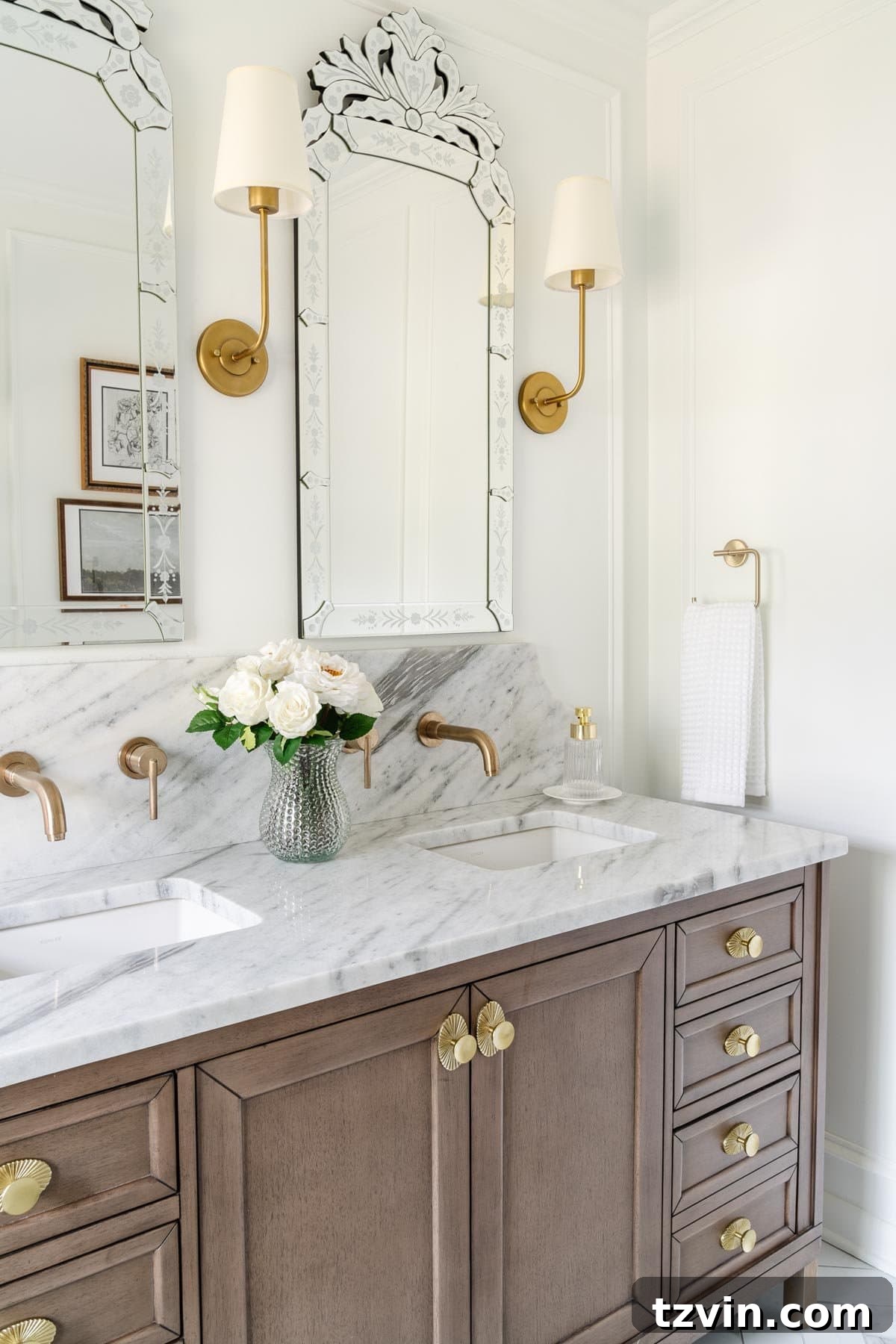 12 Furniture Upgrades That Make Your Pieces Look Expensive 11 primary bathroom vanity with gold pulls and marble countertop with backsplash