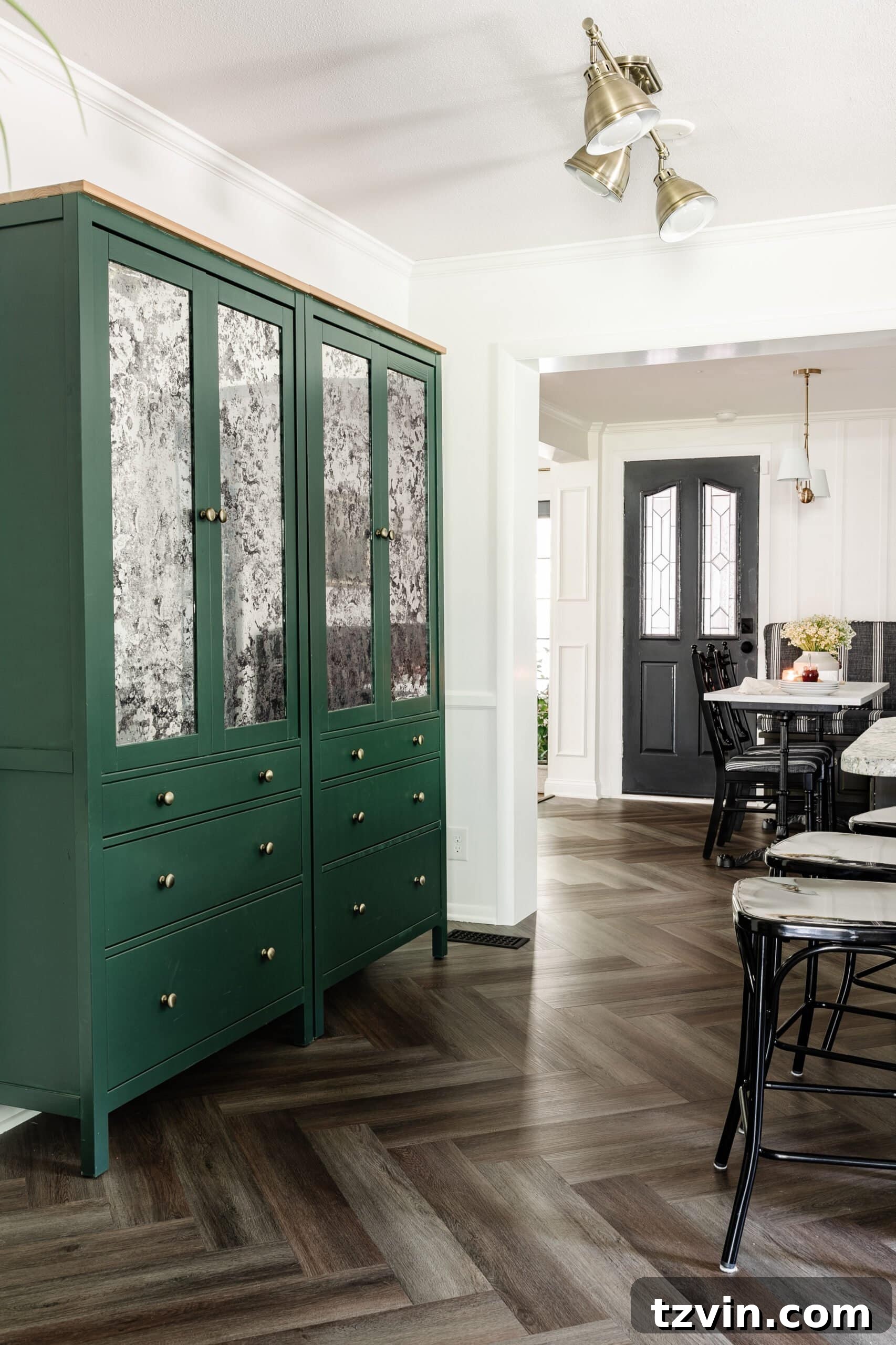 12 Furniture Upgrades That Make Your Pieces Look Expensive 15 antique mirror film on IKEA pantry cabinet