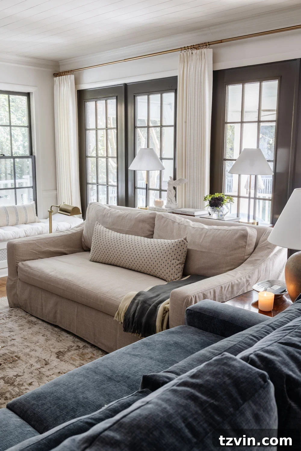 12 Furniture Upgrades That Make Your Pieces Look Expensive 30 comfort works slipcover sofa from pottery barn