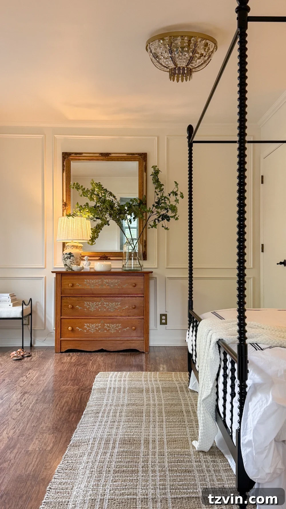 classic modern french country bedroom with layered lighting and canopy bed